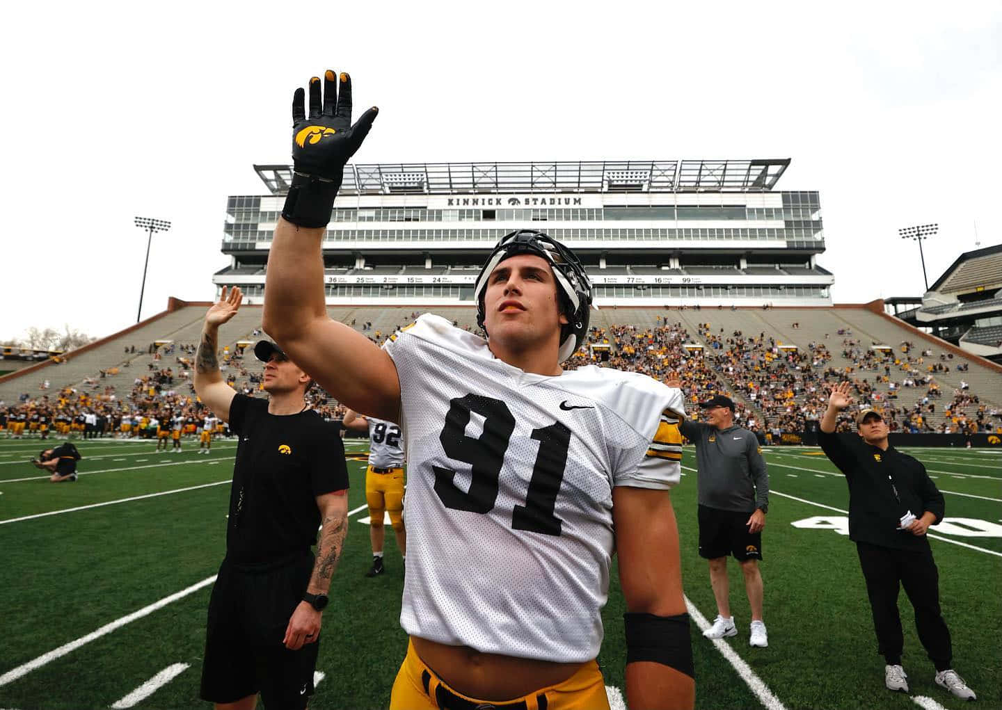 Football Player Saluting Stadium Wallpaper