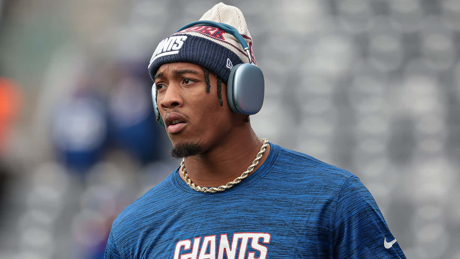 Football Player Wearing Headphonesand Giants Apparel Wallpaper