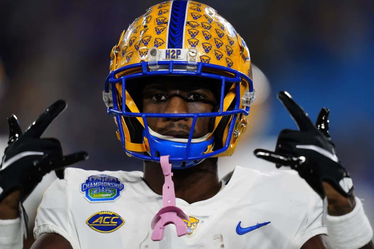 Football Player With Decorated Helmet Wallpaper