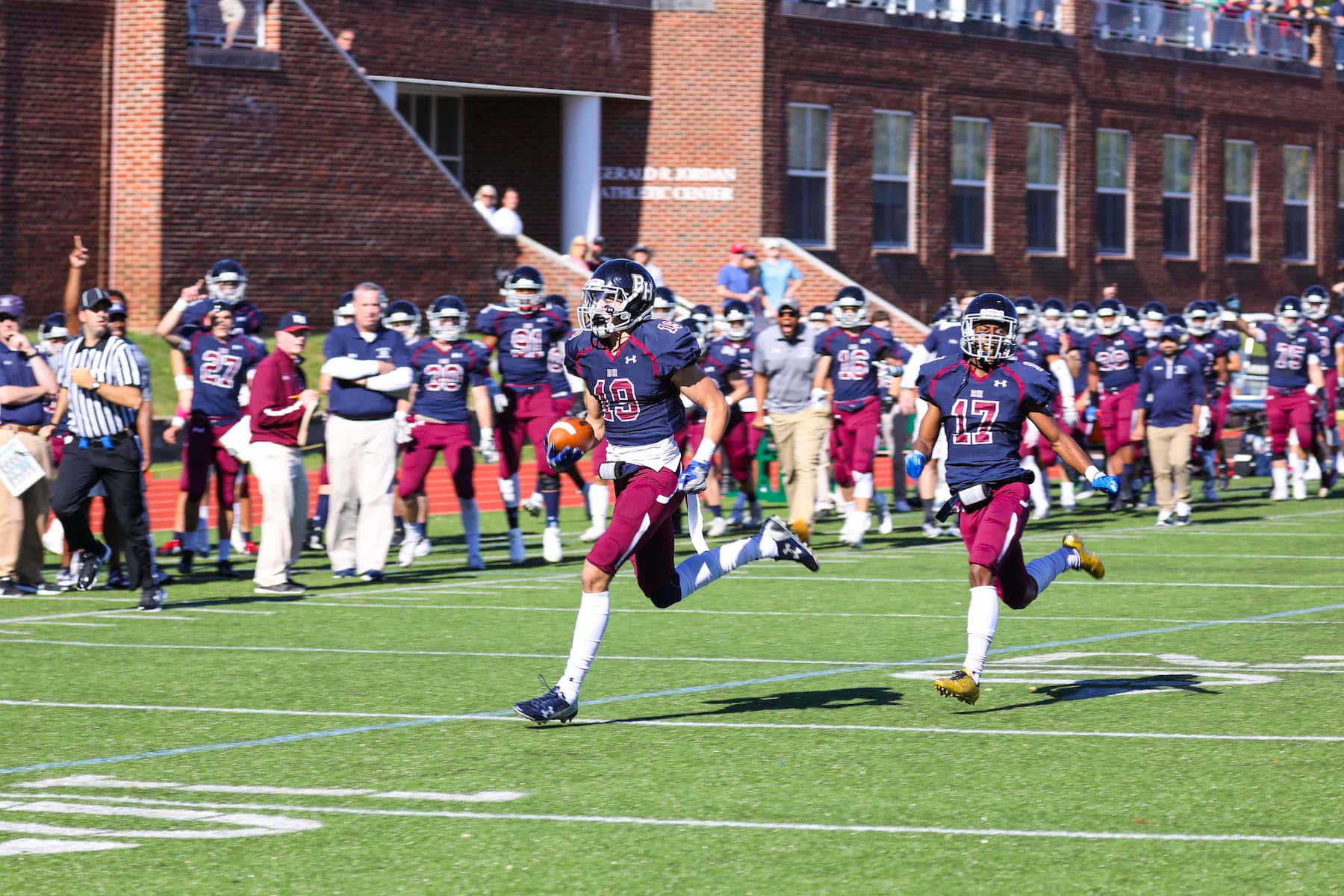 Football Players Celebrating Victoryon Field.jpg Wallpaper