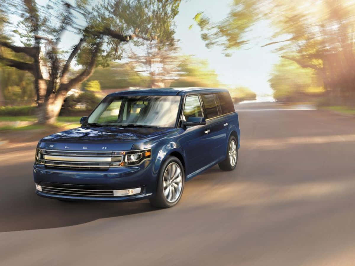 Ford Flex Cruising Down The Highway Wallpaper