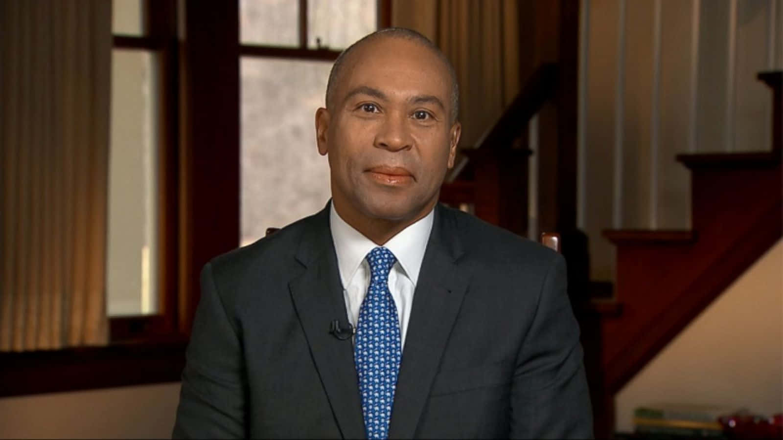 Former Governor Deval Patrick Climbing A Staircase Wallpaper