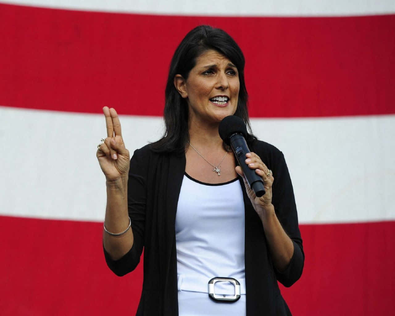 Former U.s Ambassador Nikki Haley Confidently Flashing A Peace Sign Wallpaper