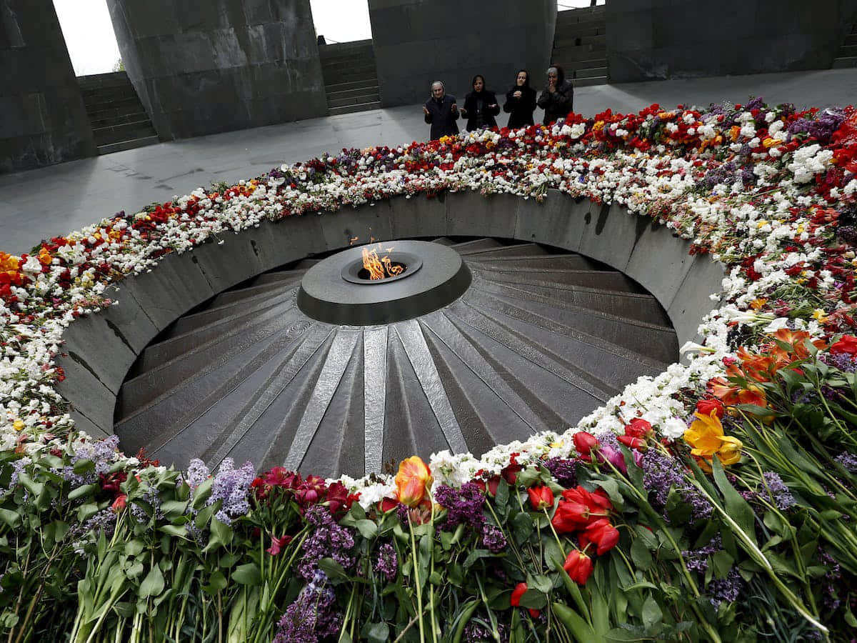 Four People At Armenian Genocide Memorial Wallpaper