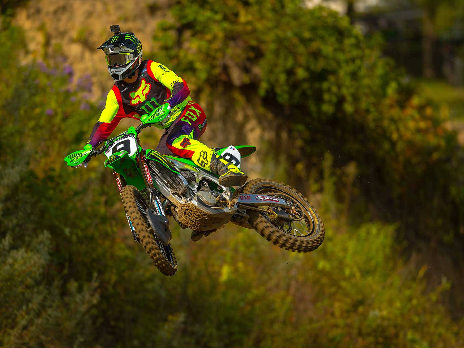 Fox Racing Dirt Bike On Grassy Lands Wallpaper