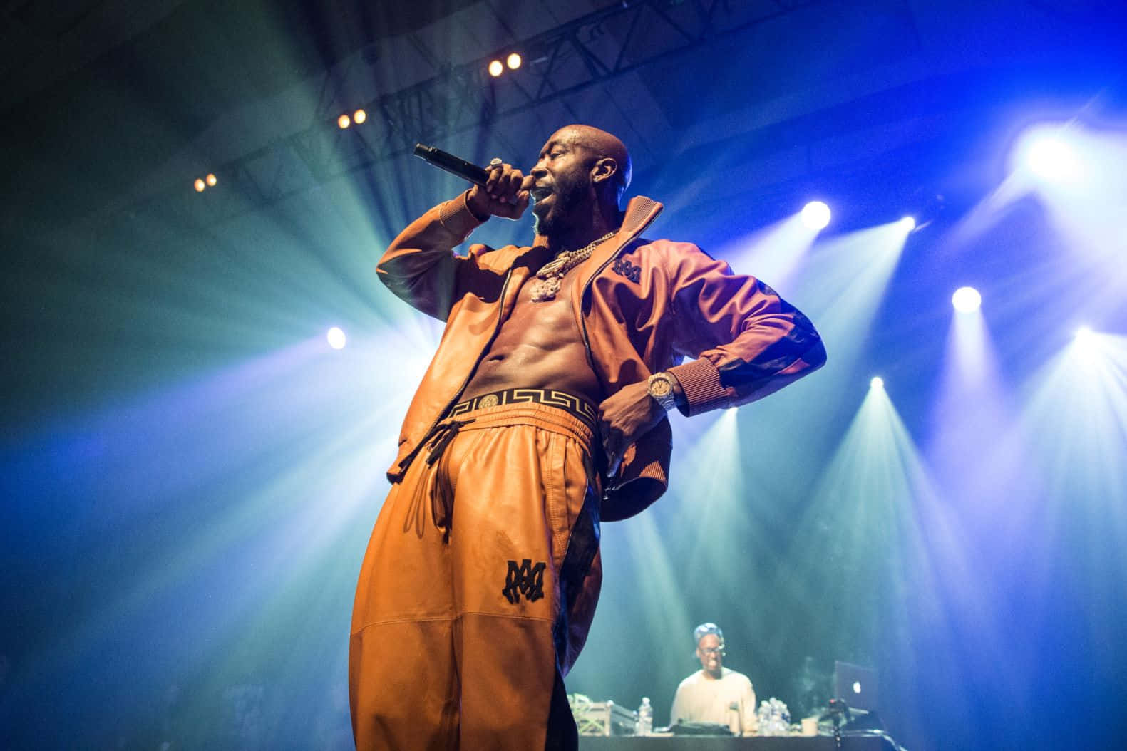 Freddie Gibbs Performing Liveon Stage Wallpaper