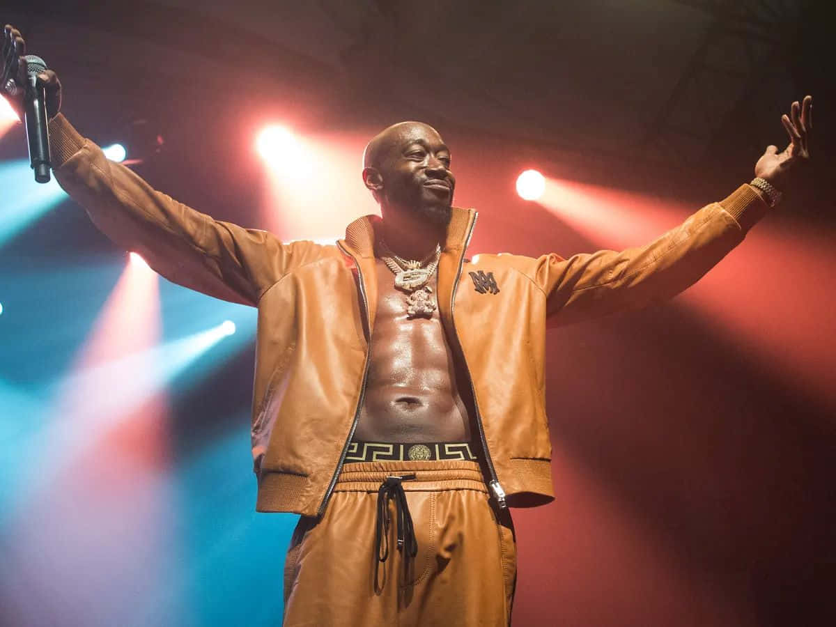 Freddie Gibbs Performingon Stage Wallpaper