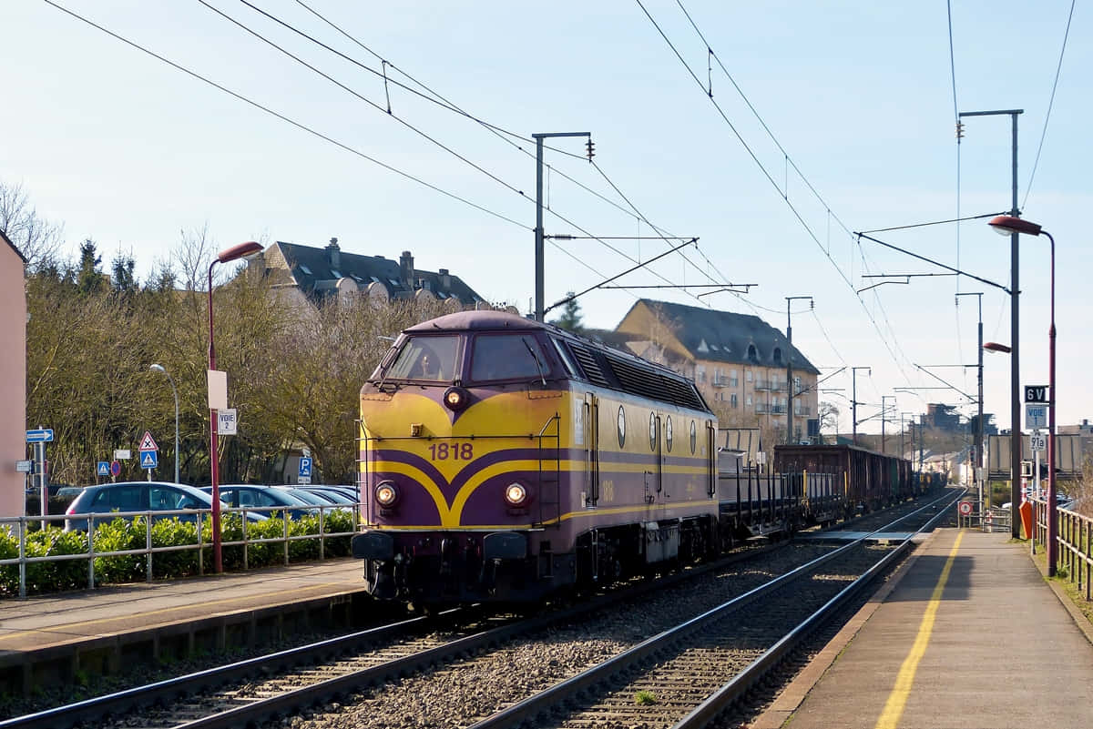 Freight Train Passing Schifflange Station Luxembourg Wallpaper