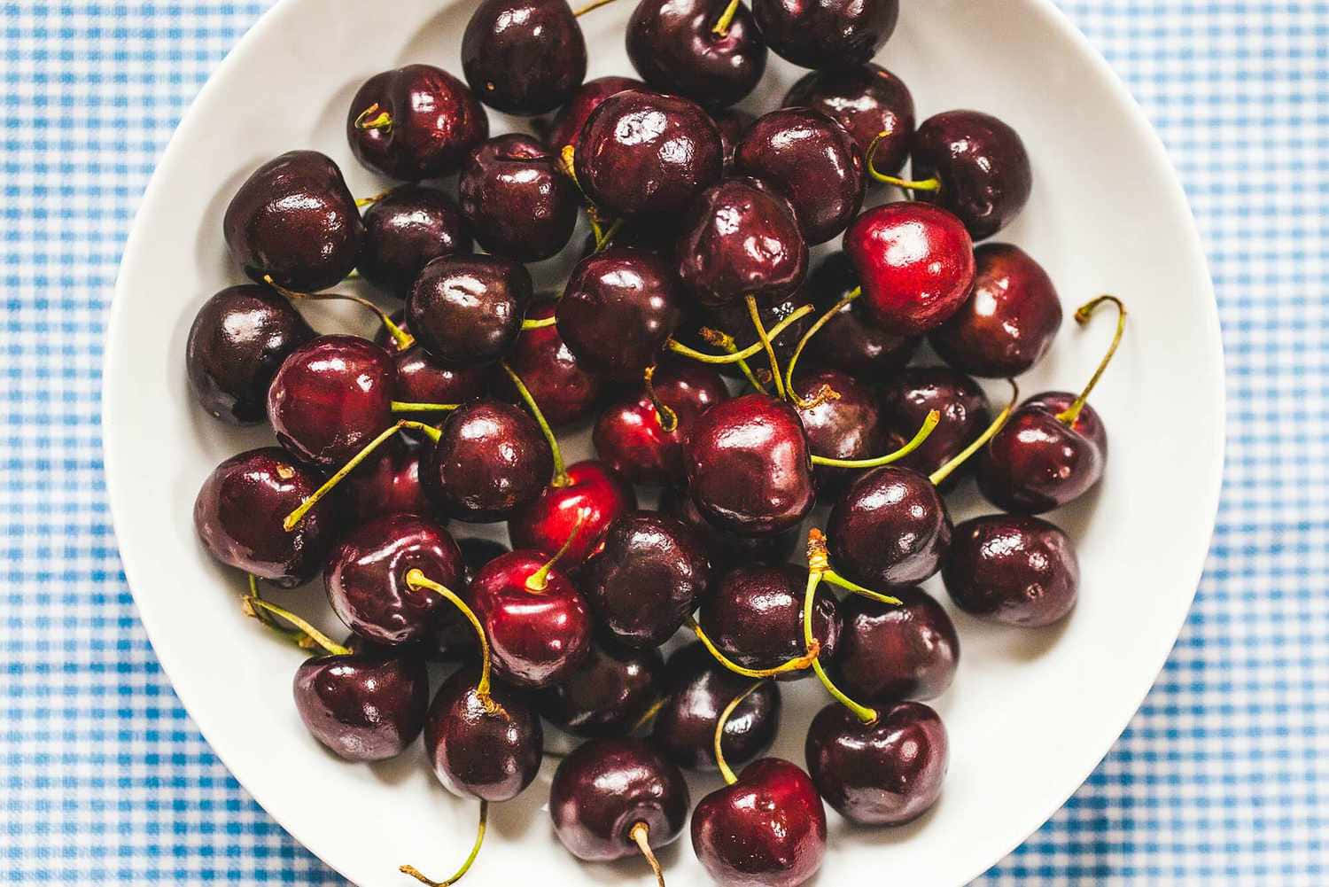 Fresh And Vibrant Red Cherries Wallpaper