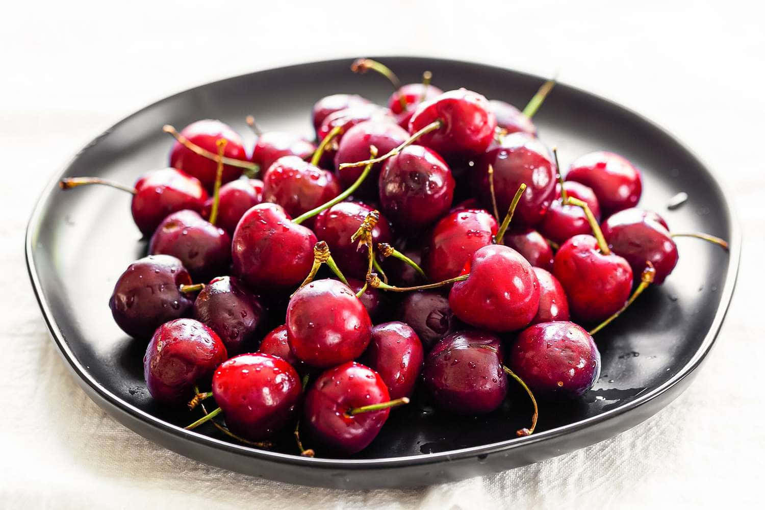 Fresh And Vibrant Red Cherries Wallpaper