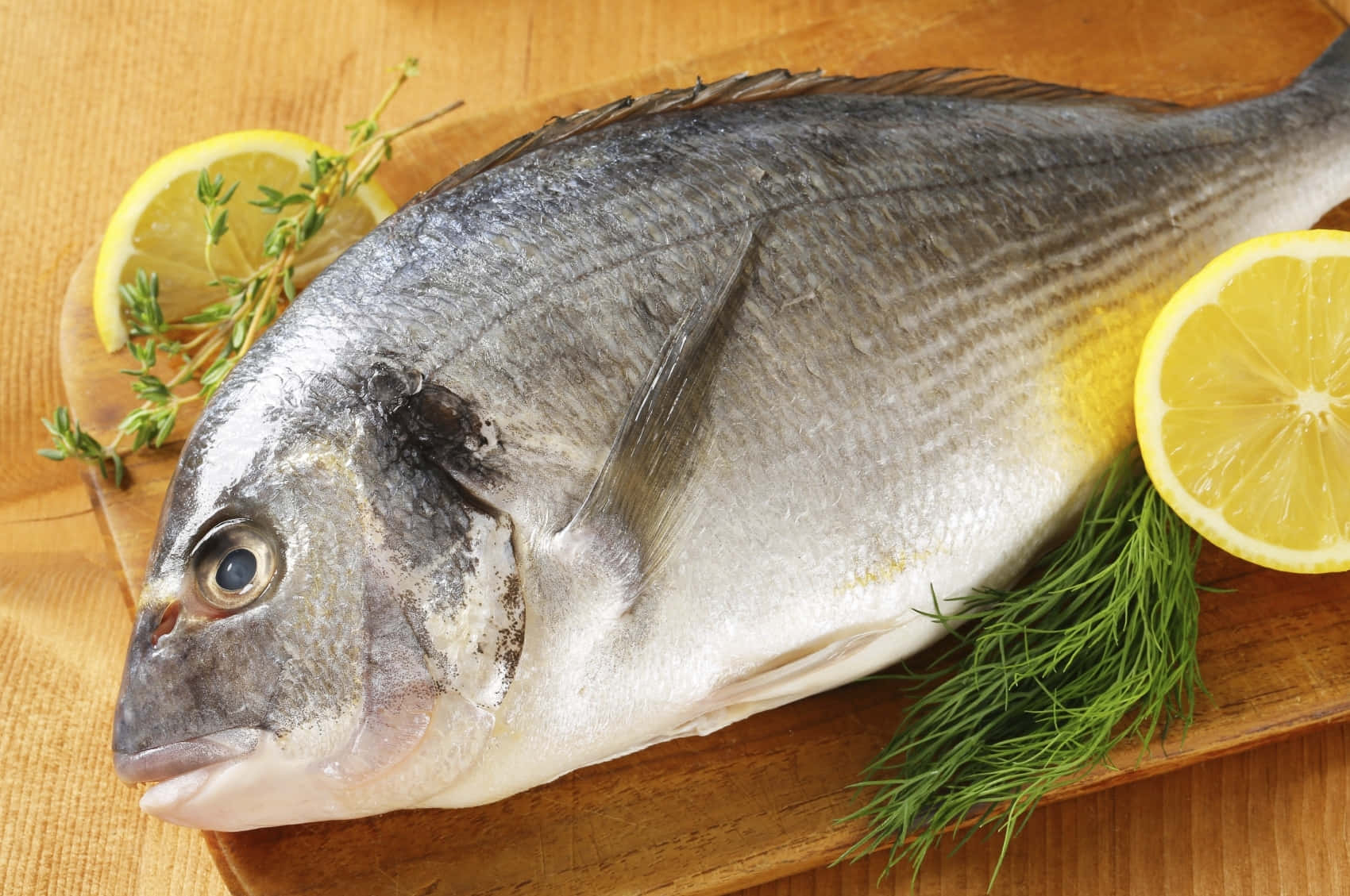 Fresh Bream Fish With Herbs And Lemon Wallpaper