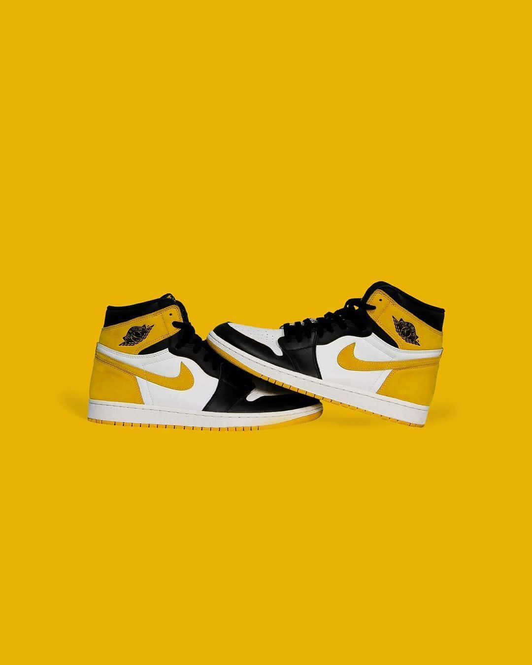 Fresh Out Of The Box, The Iconic Yellow And Black Jordan. Wallpaper