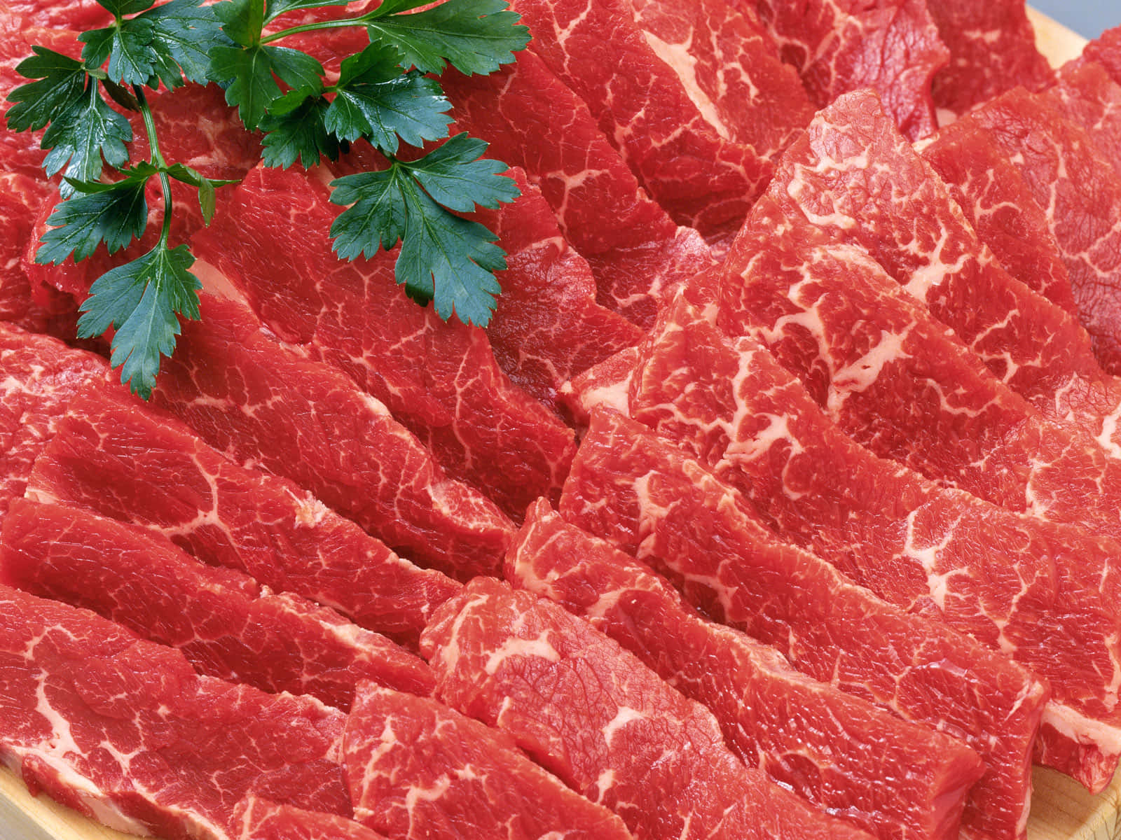 Fresh Raw Red Meat On A Cutting Board Wallpaper