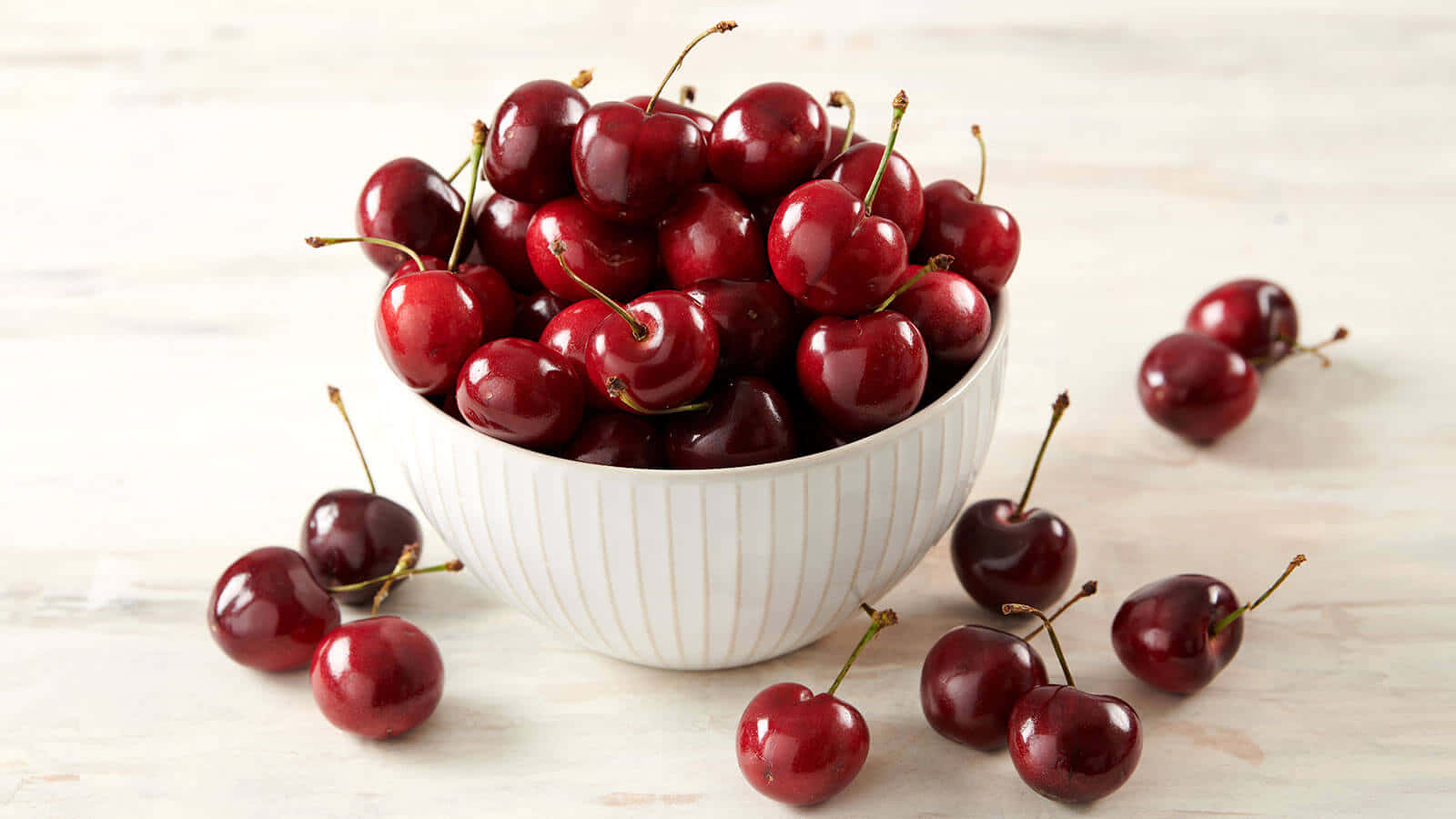 Fresh Red Cherries On Display Wallpaper