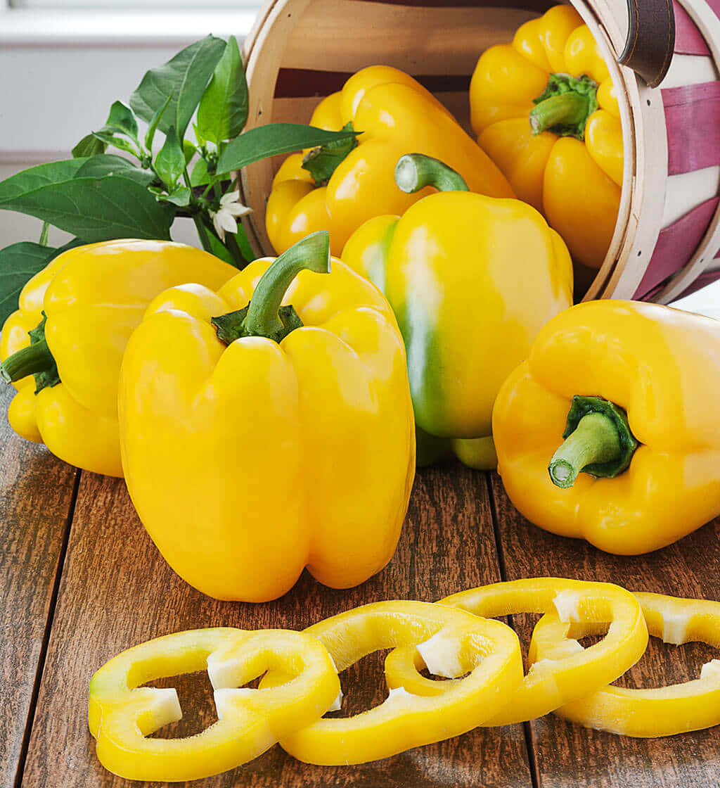 Fresh Yellow Bell Pepper On A Wooden Table Wallpaper