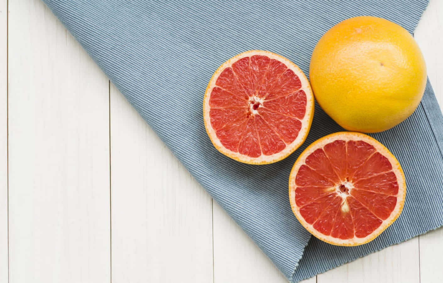 Freshly Sliced Pink Grapefruit Wallpaper