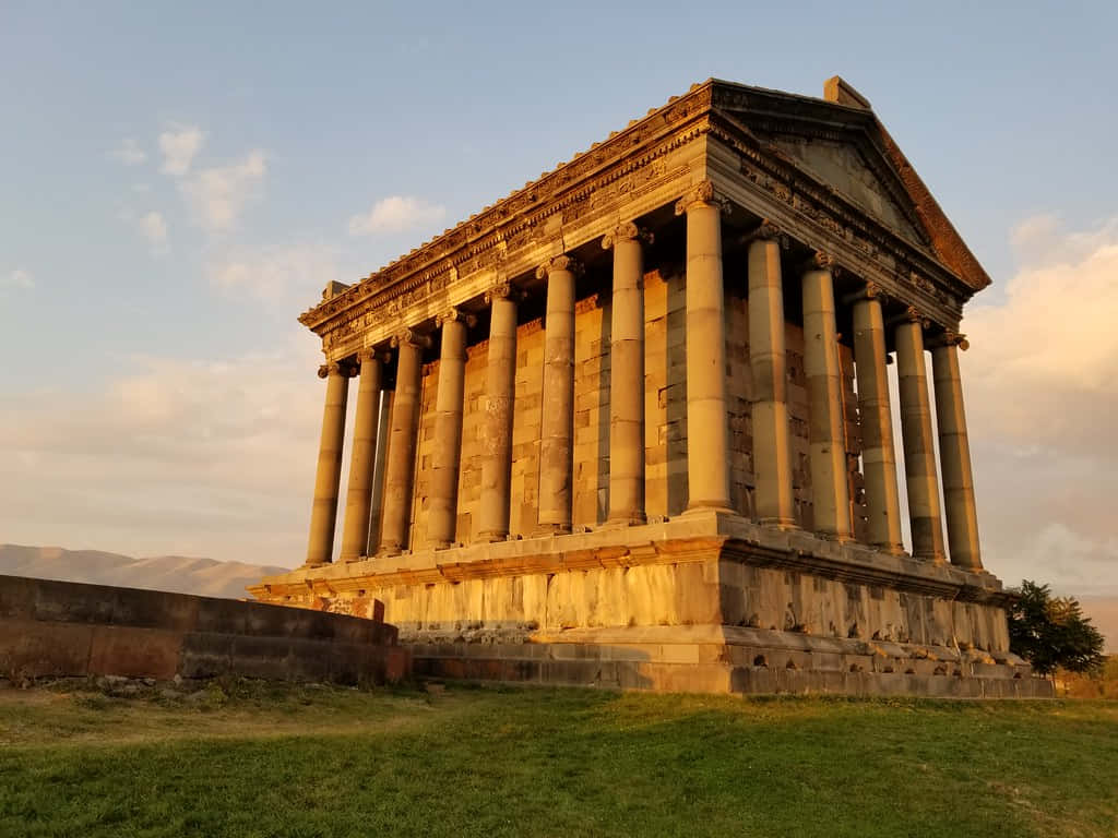 Garni Temple With Orange-tinted Clouds Wallpaper