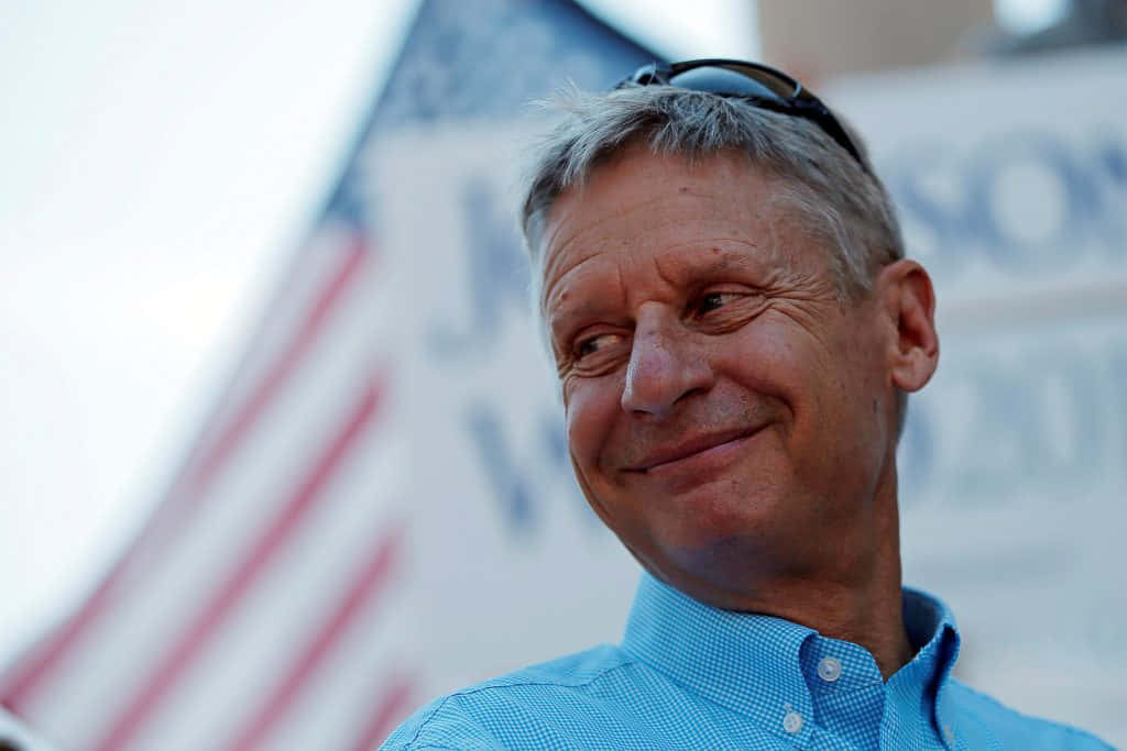 Gary Johnson Smiling In A Blue Shirt Wallpaper