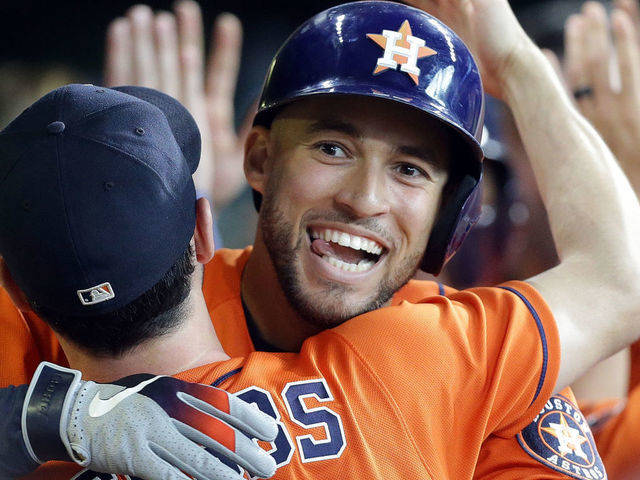 George Springer Hugging A Teammate Happy Wallpaper