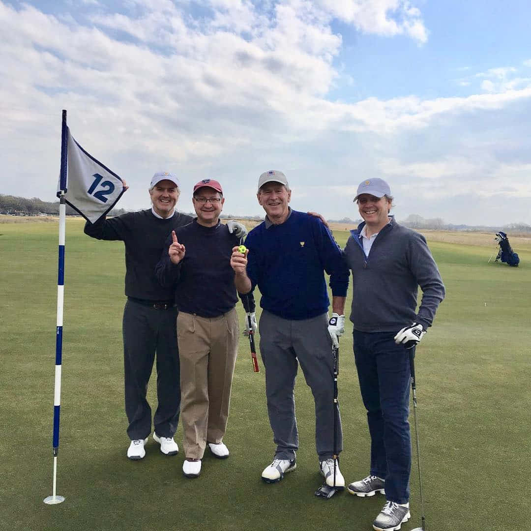 George W. Bush With Friend In Golf Field Wallpaper