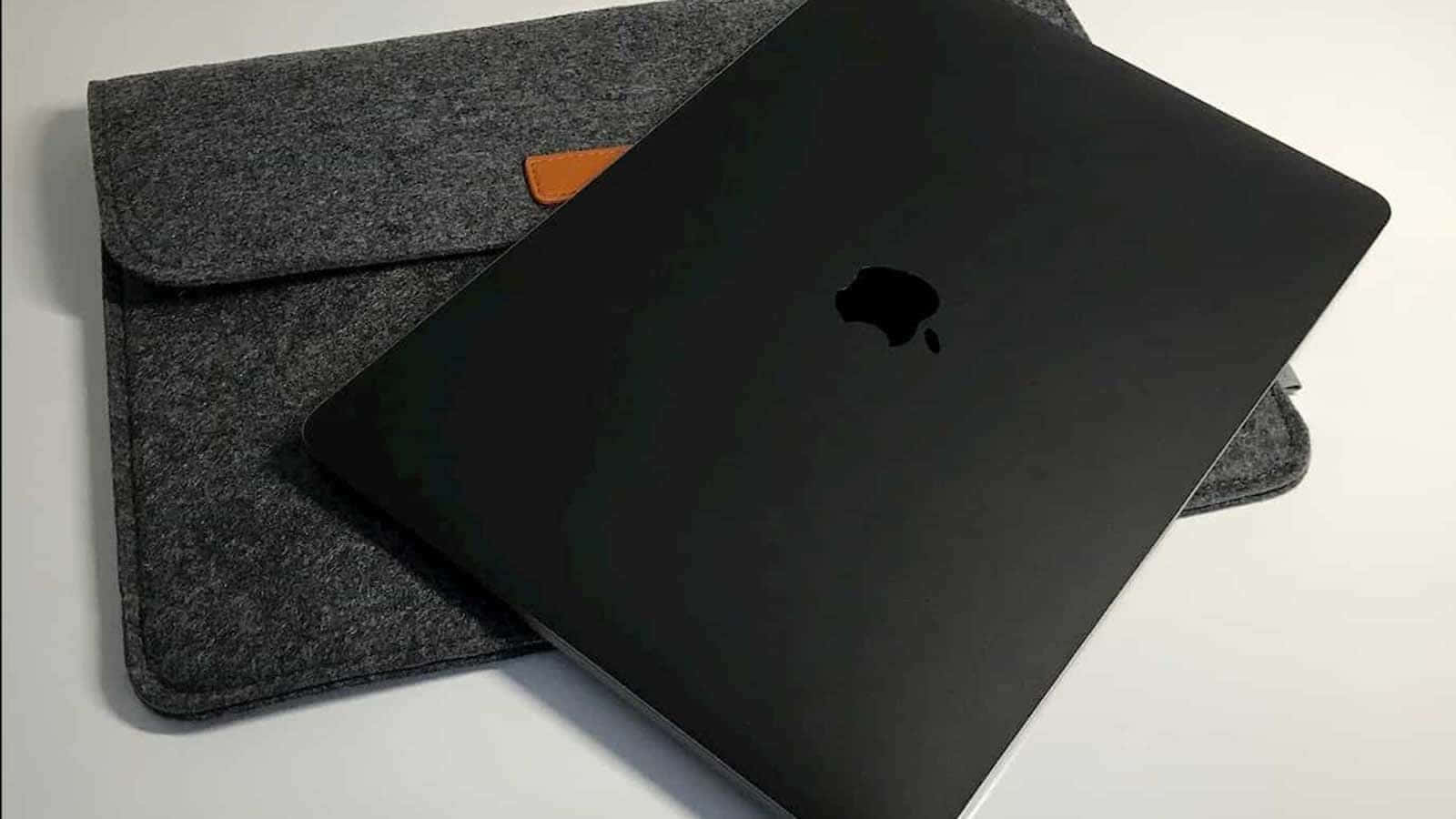 Get Ready For A Professional Experience With The Black Macbook Wallpaper