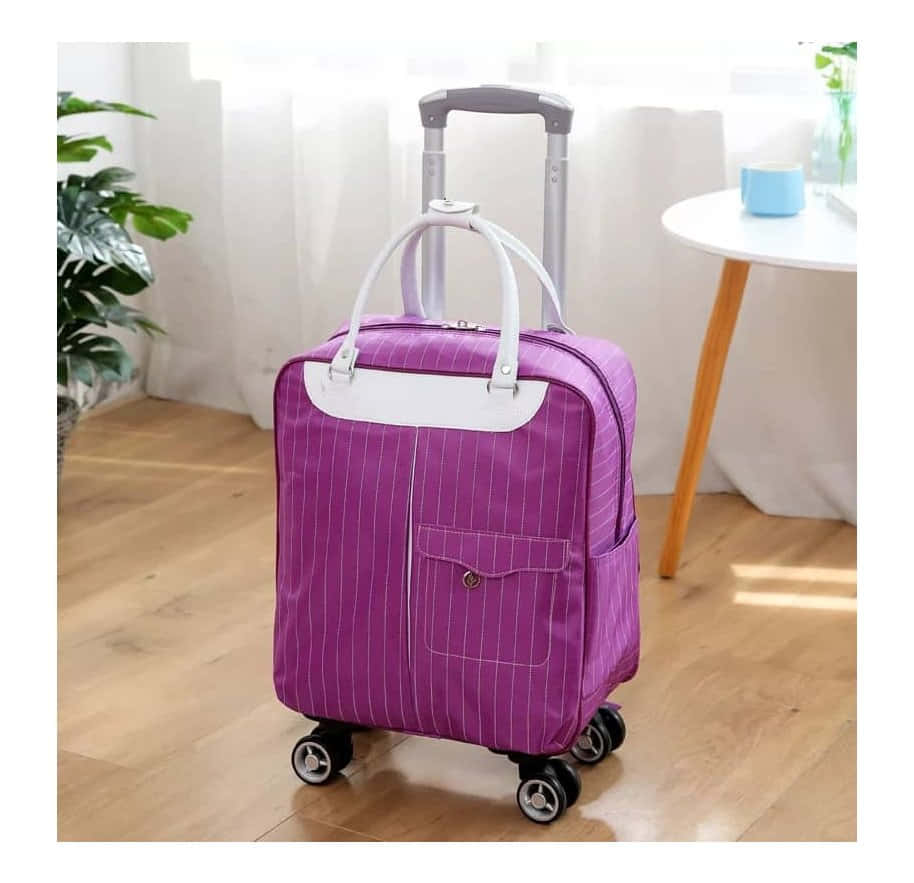 Get Ready For Your Adventure With A Purple Suitcase Wallpaper