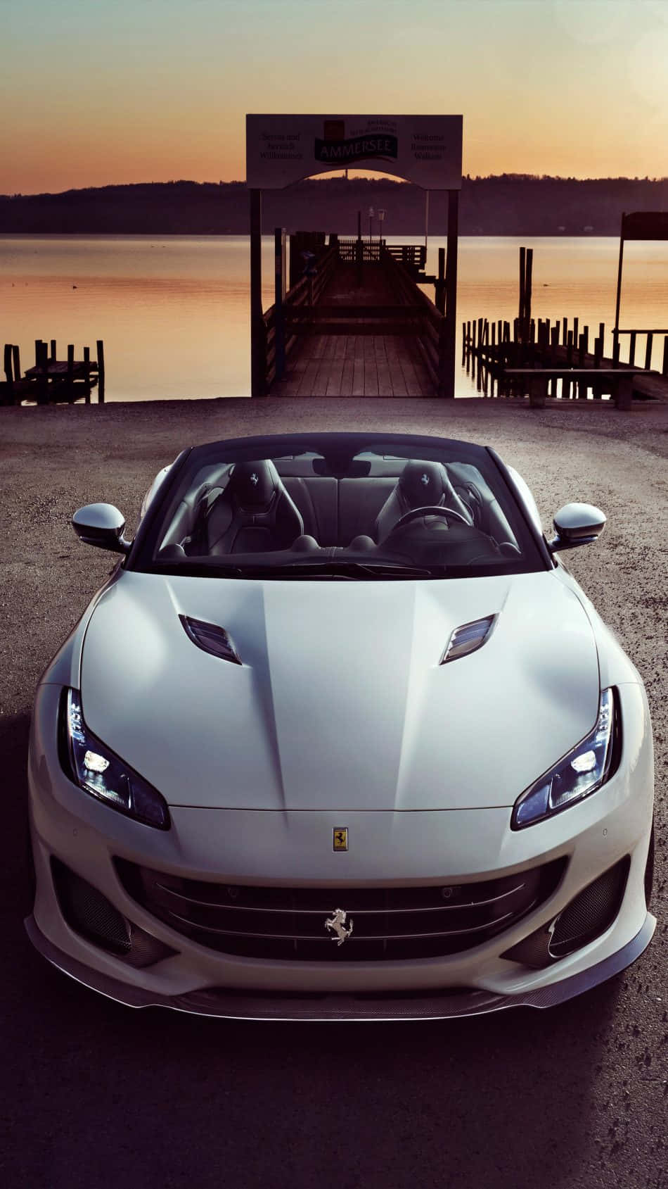 Get Ready To Set Off On A Thrilling Ride With This Sleek White Ferrari Iphone Wallpaper