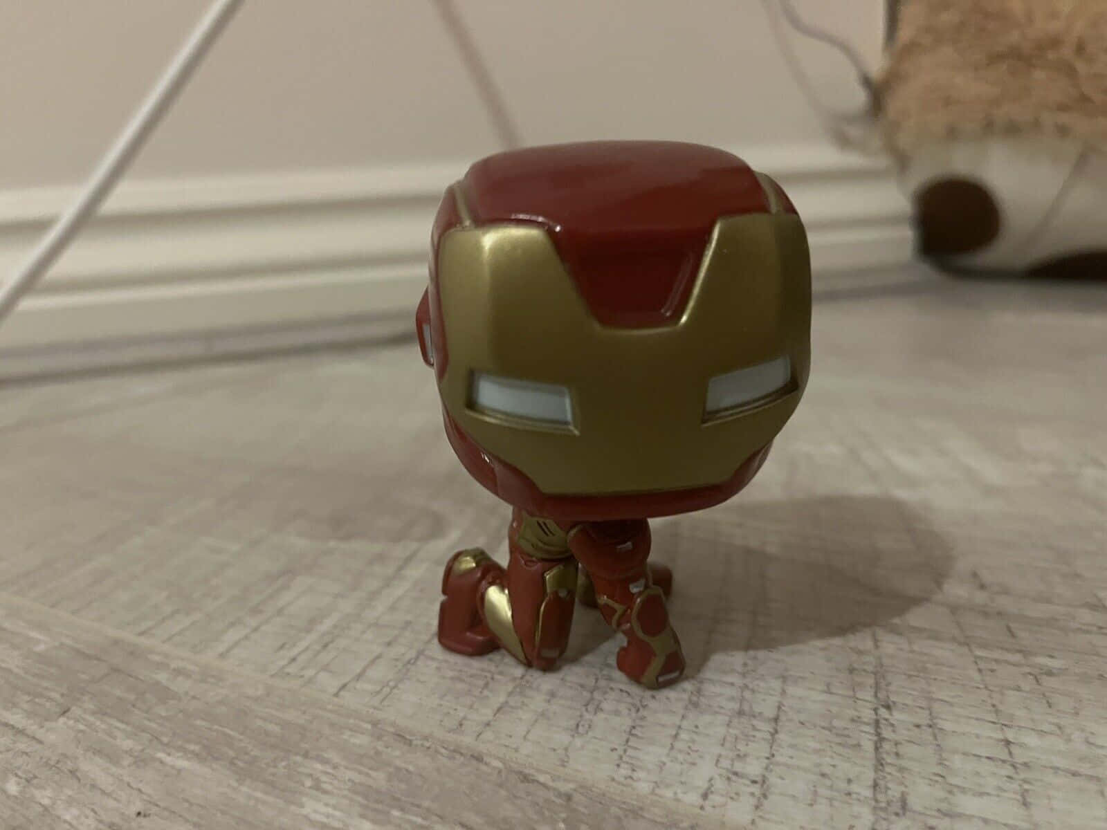 Get Your Hands On Iconic Superhero Iron Man Pop Figures Wallpaper