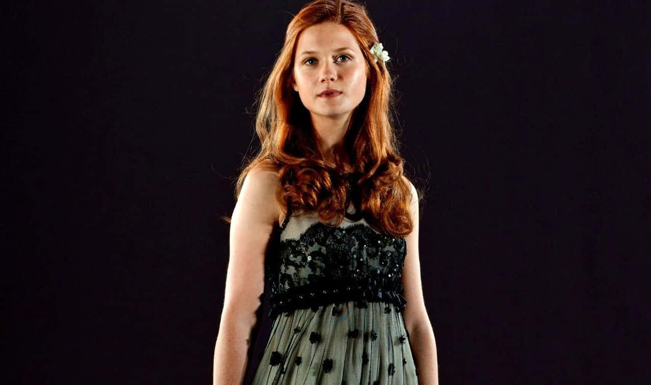 Ginny Weasley Casting A Spell In Battle Wallpaper