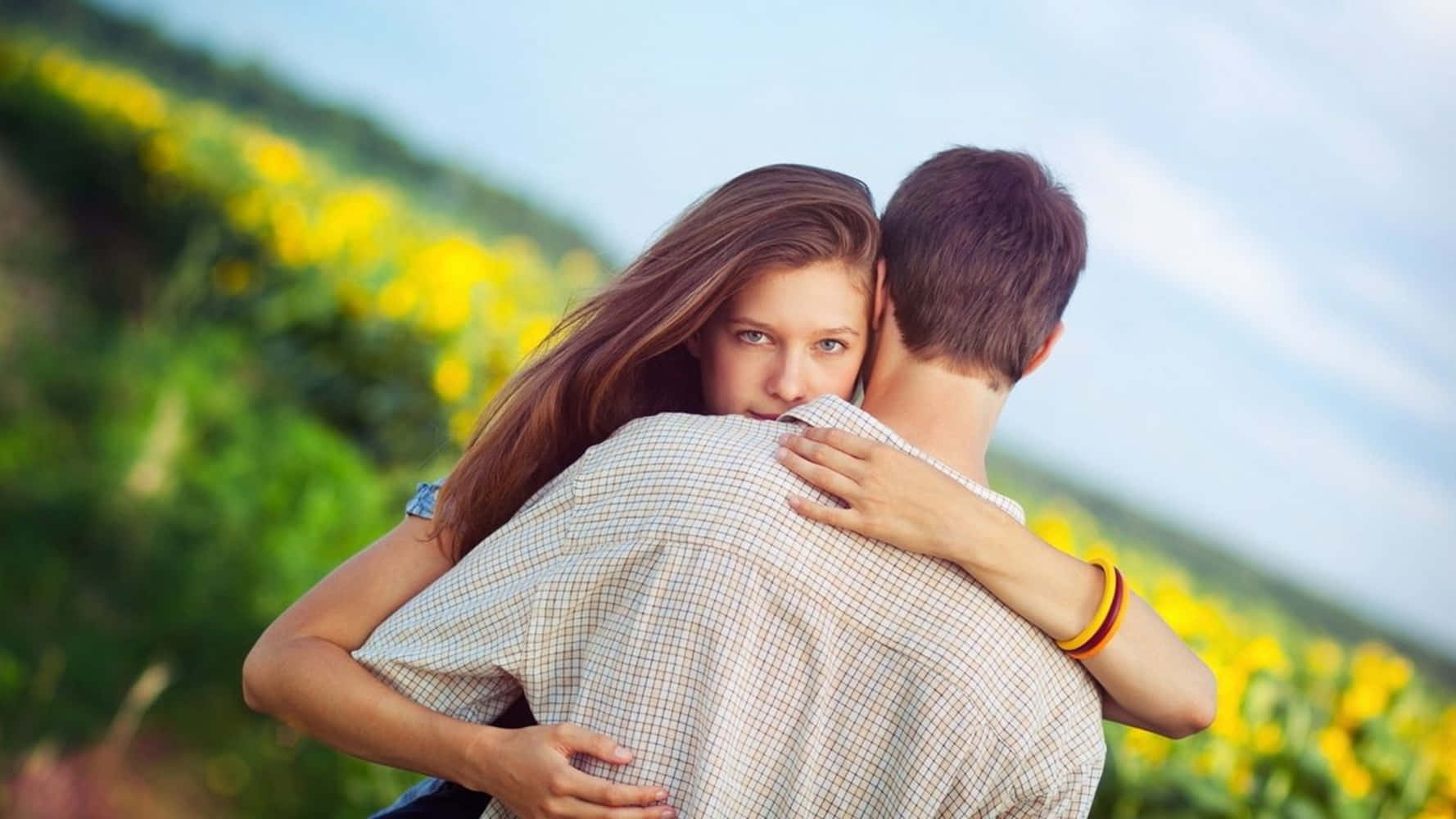 Girlfriend And Boyfriend In Flower Field Wallpaper