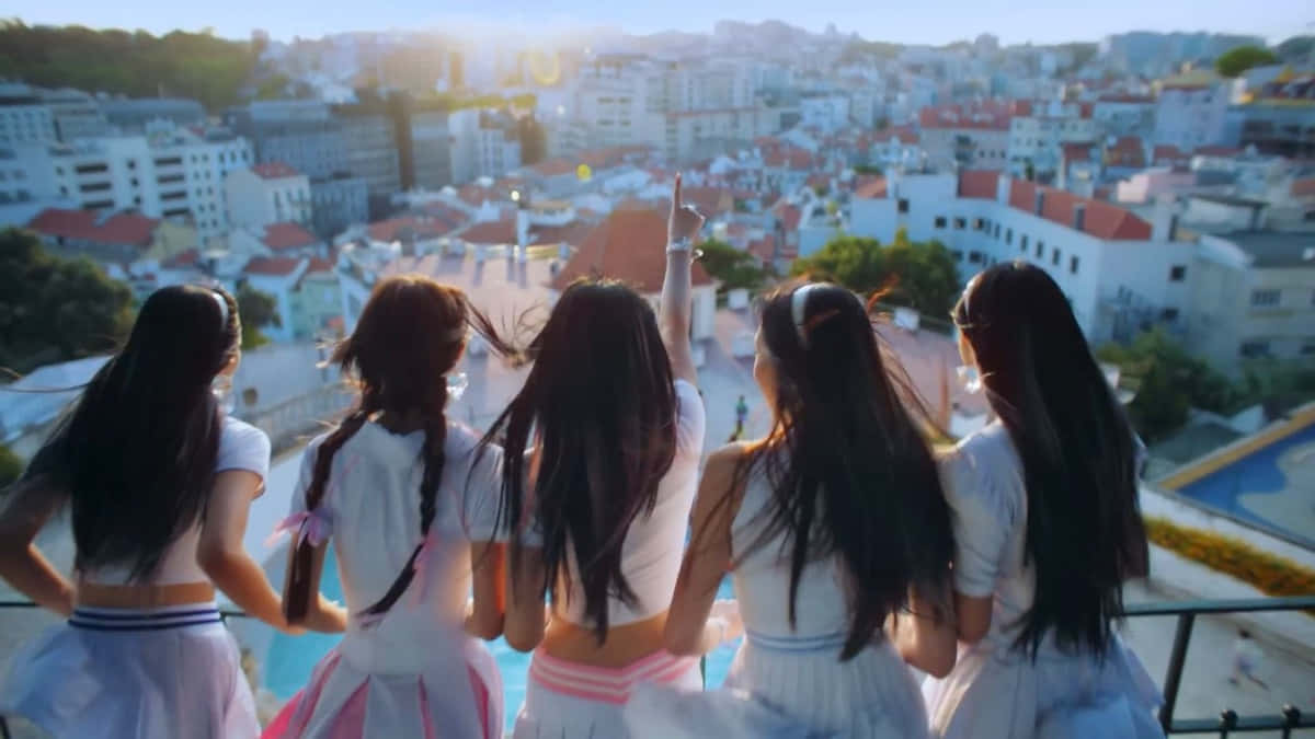 Girls Overlooking Cityscape Wallpaper