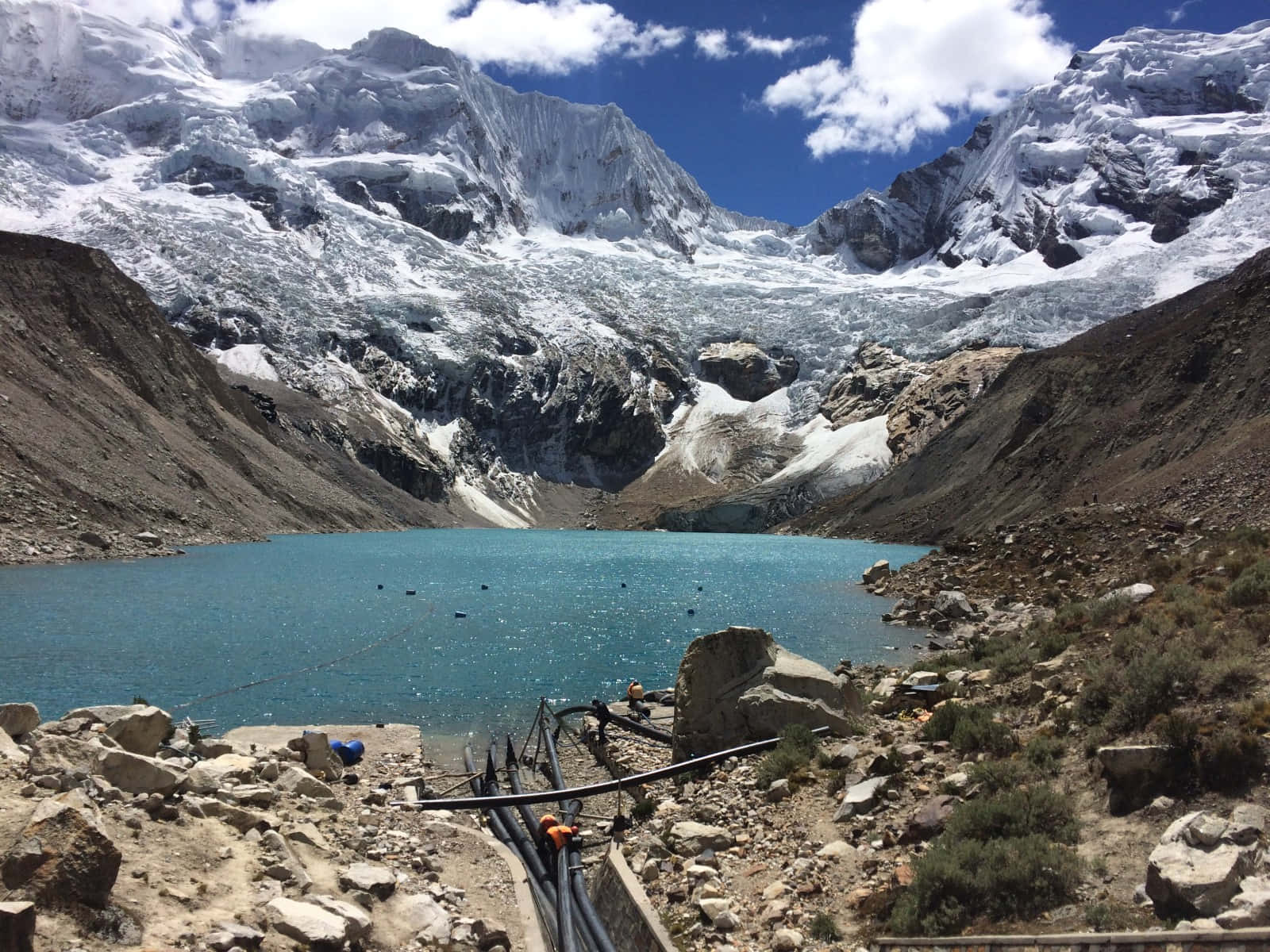 Glacial_ Lake_and_ Mountain_ Snowcaps Wallpaper