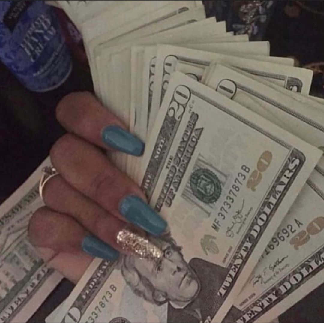 Glamorous Nails Holding Cash.jpg Wallpaper