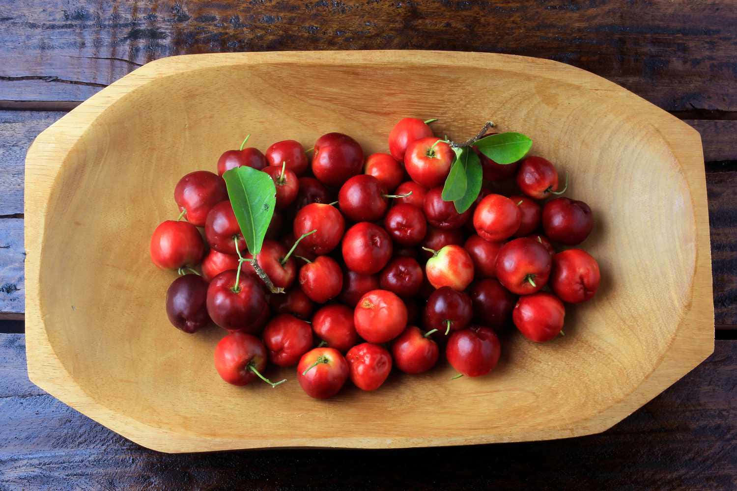 Gleaming Red Cherries On Display Wallpaper