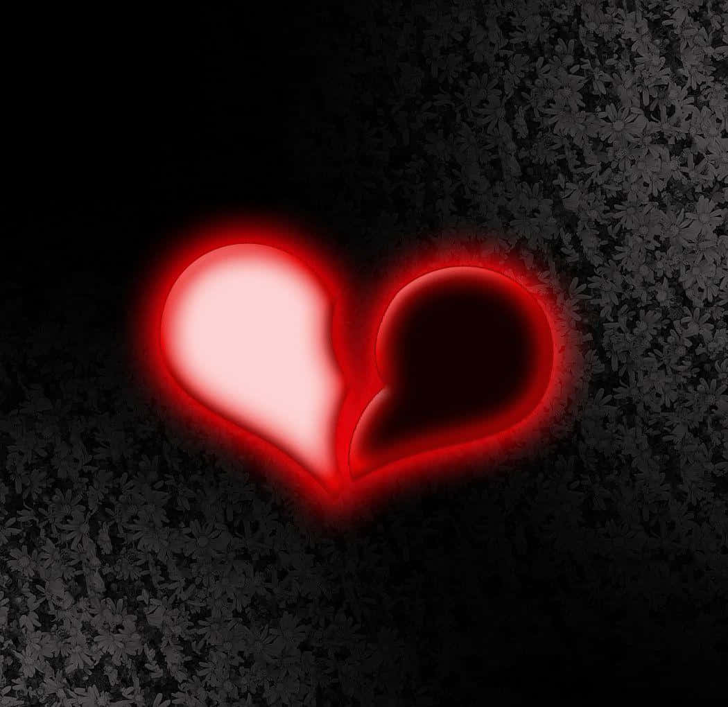 Glowing Heart Brokenin Darkness Wallpaper