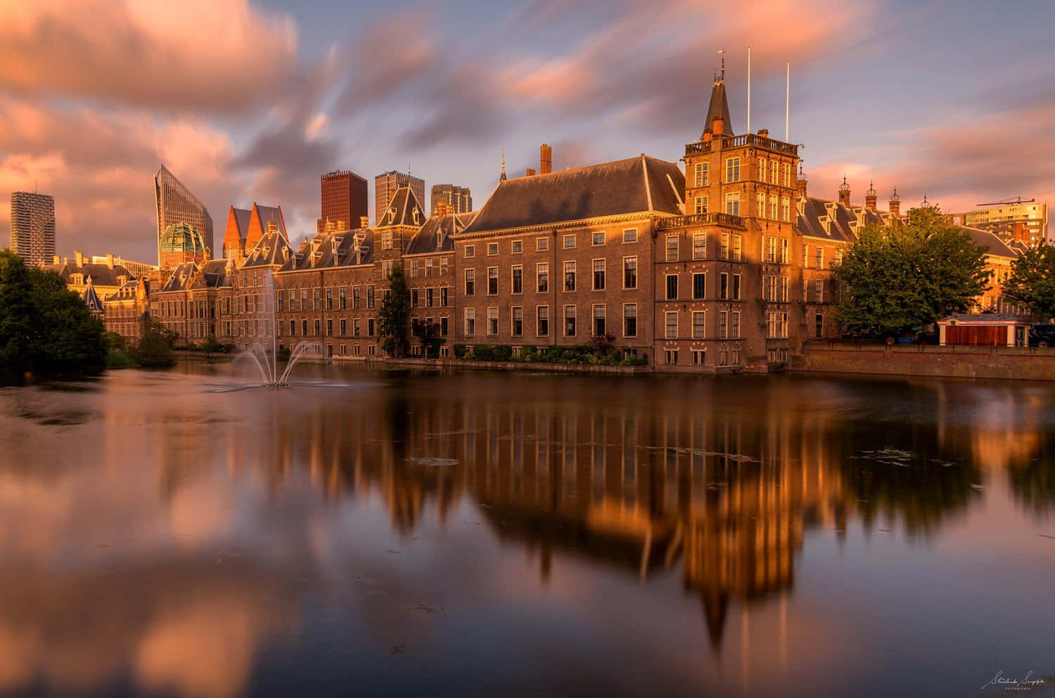 Golden Hour Reflections_ Historical Building Waterfront Wallpaper