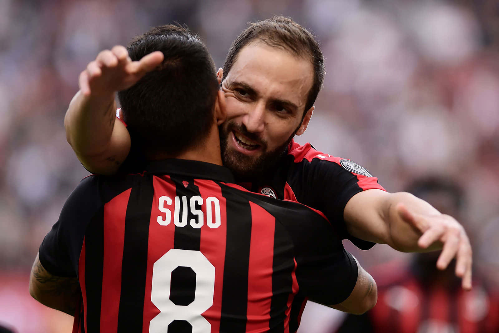 Gonzalo Higuain Hugging Fernandez Suso Wallpaper