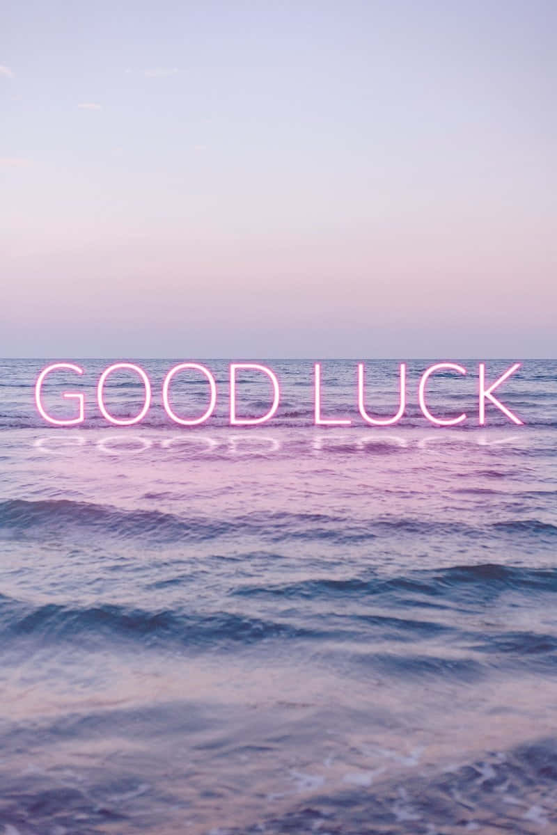 Good Luck Neon Sign Ocean Backdrop Wallpaper