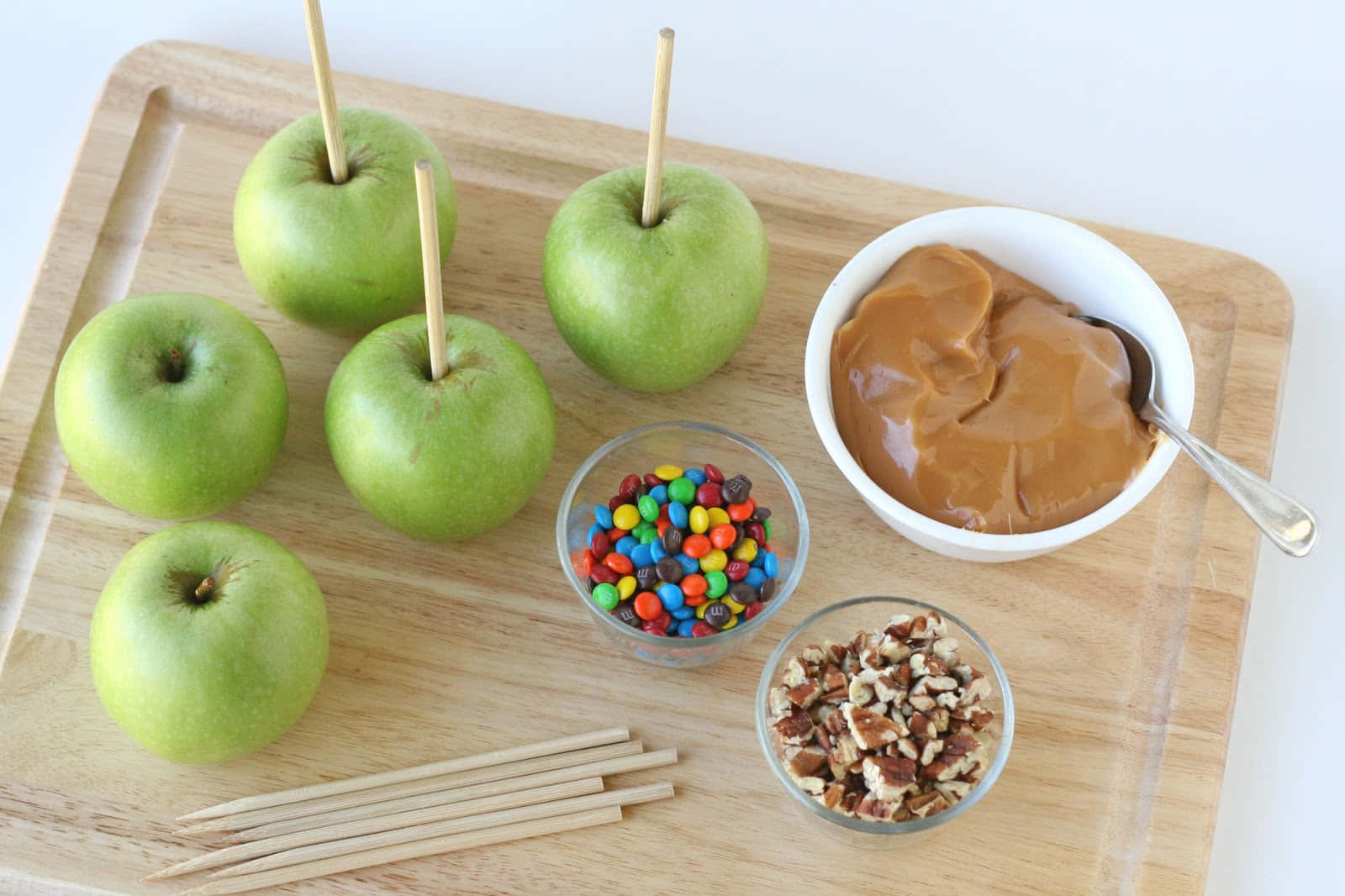 Gourmet Caramel Apples On Display Wallpaper