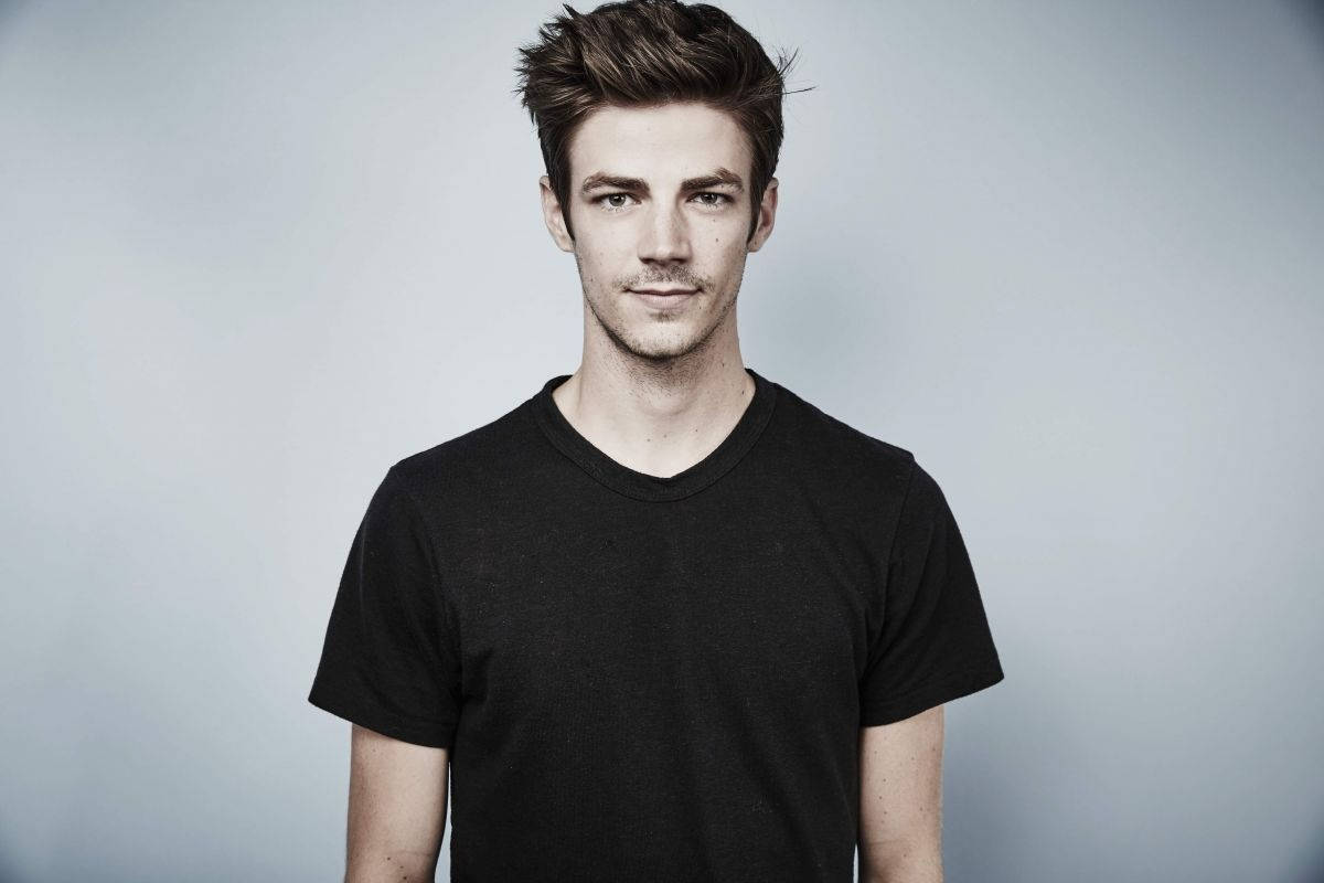 Grant Gustin In Black Casual Wallpaper