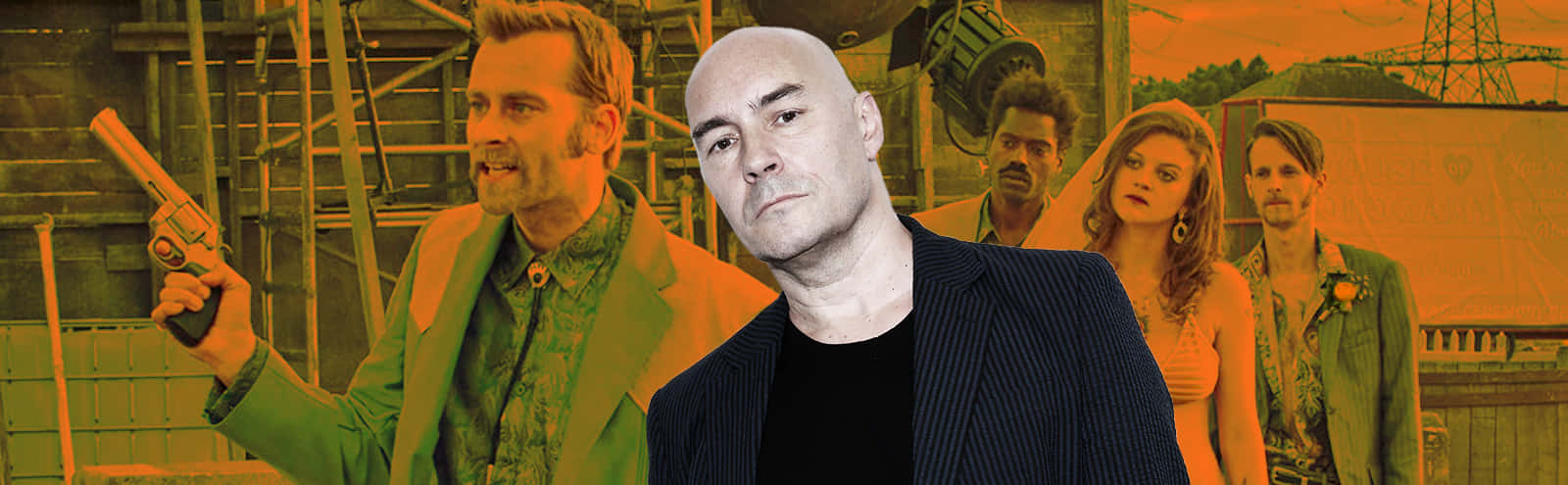 Grant Morrison Posing With Comic Book Background Wallpaper