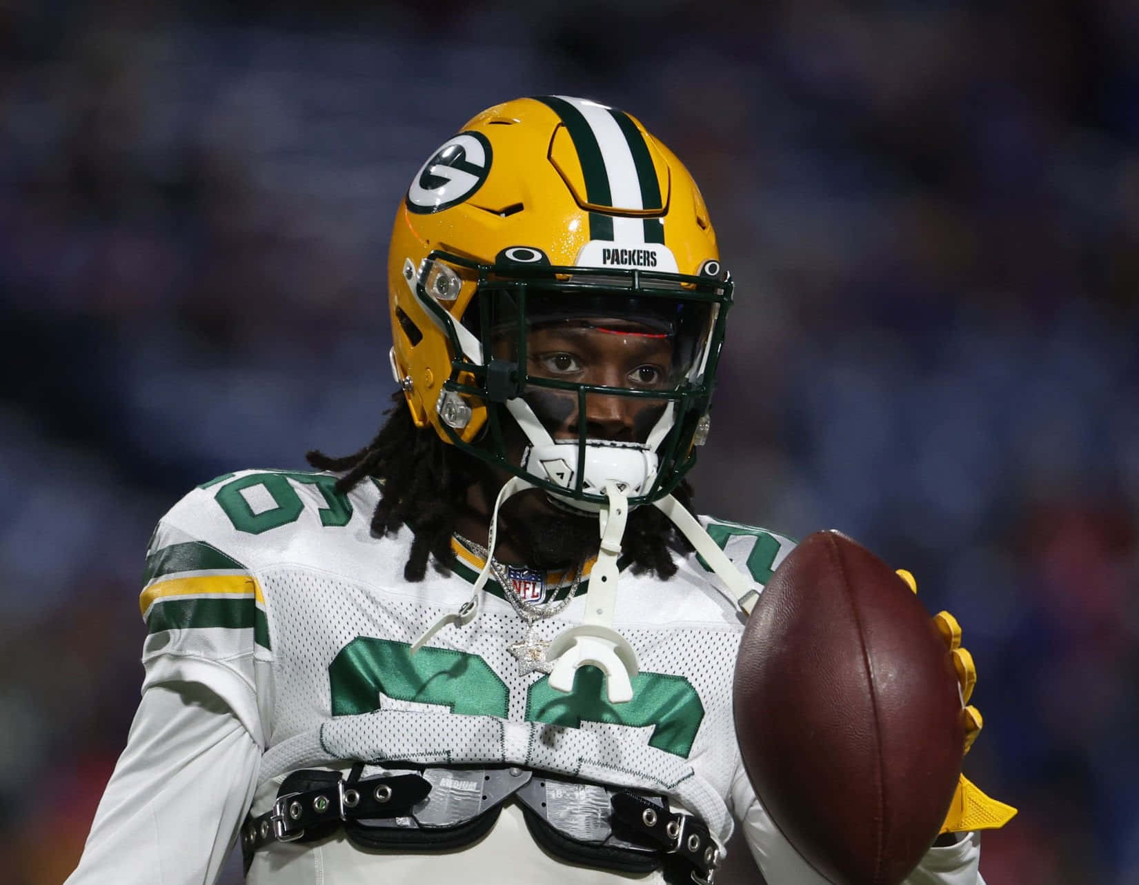 Green Bay Defensive Player Holding Football Wallpaper