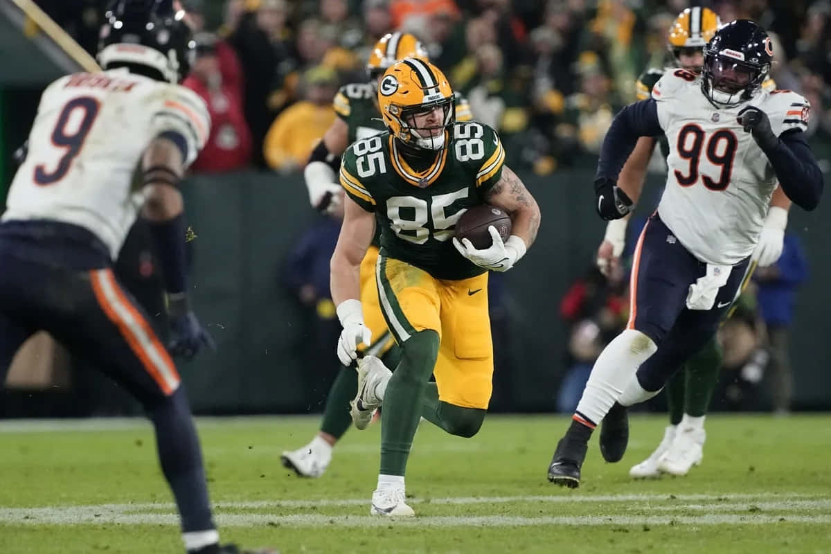 Green Bay Player Running With Football Wallpaper