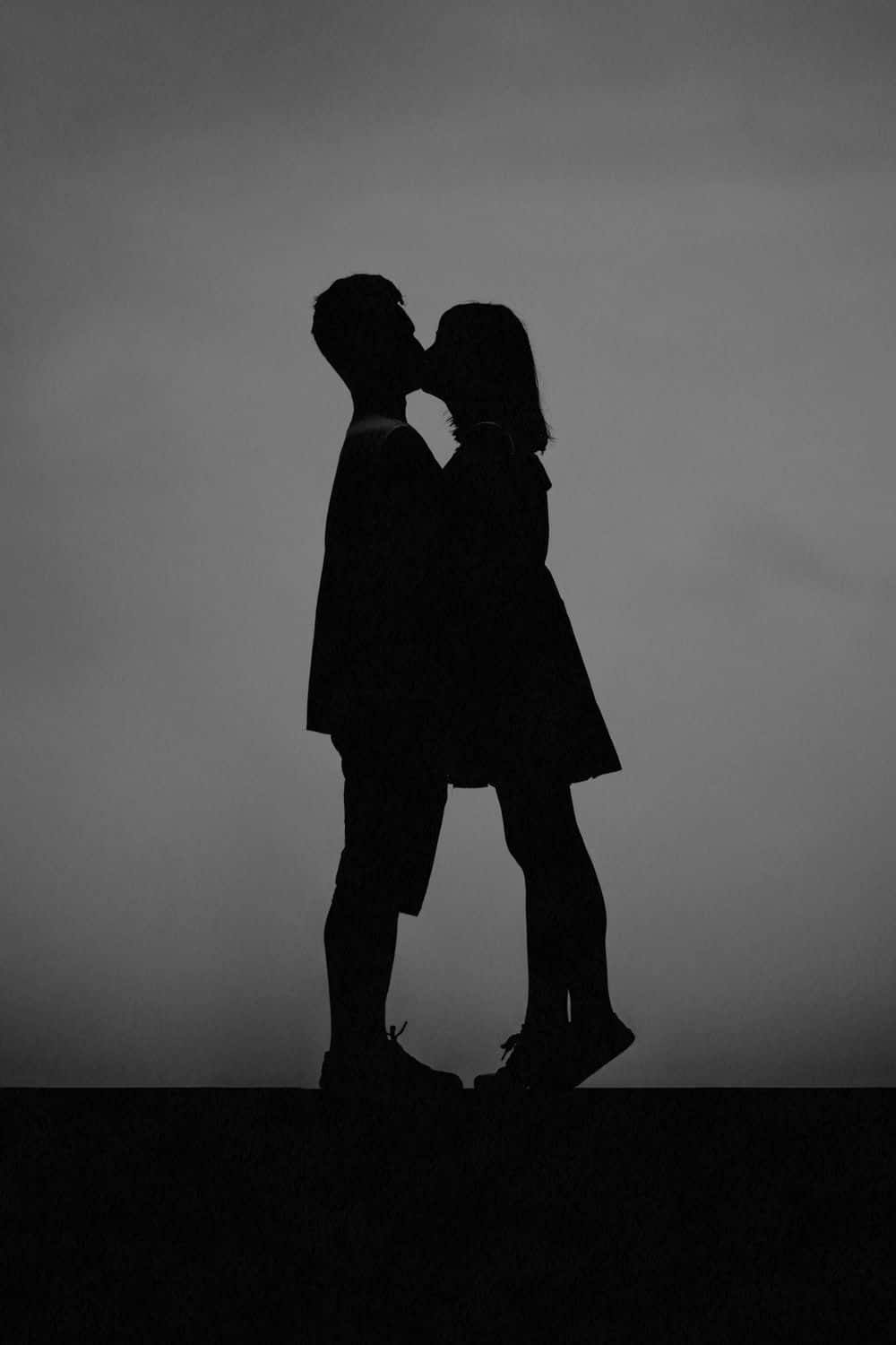 Greyscale Photo Of Kissing Lips Wallpaper