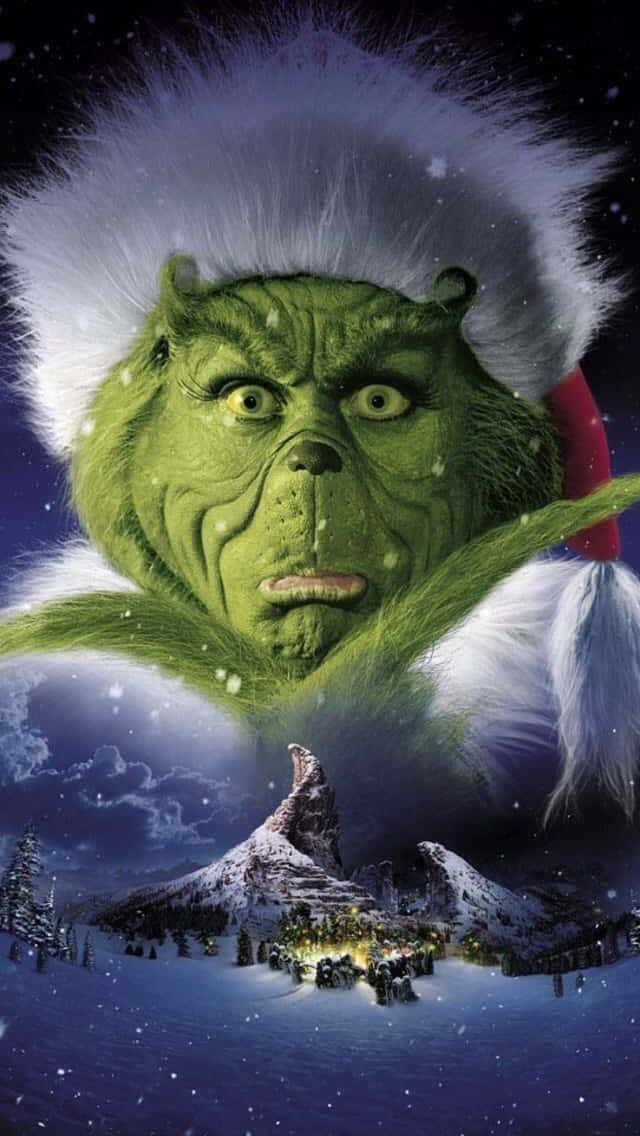 Grinch Overlooking Whoville Winter Scene Wallpaper