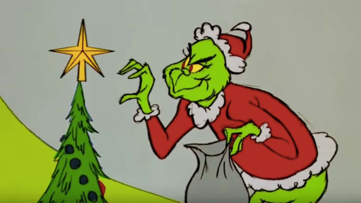 Grinch Plotting Christmas Mischief Wallpaper