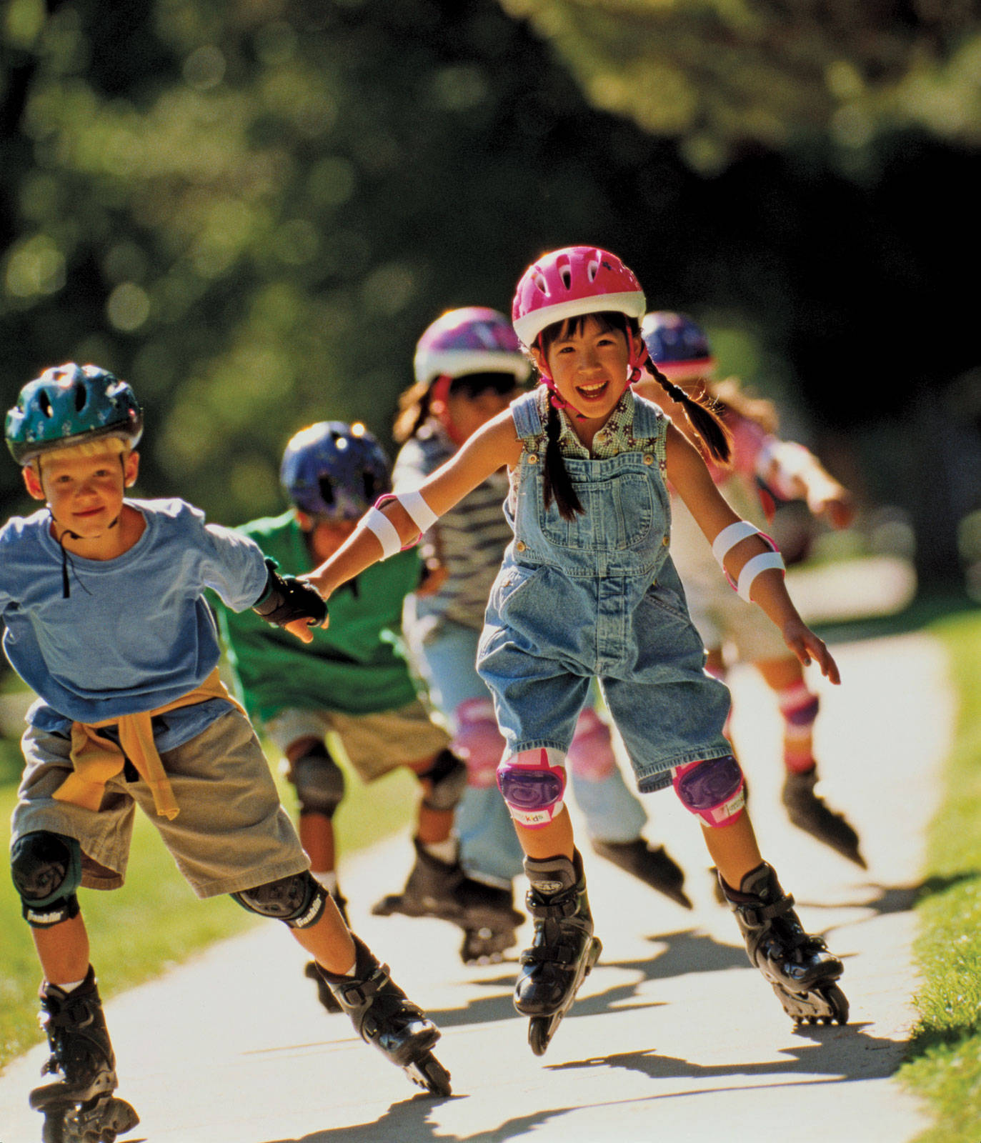 Group Of Kids Rollerblading Wallpaper