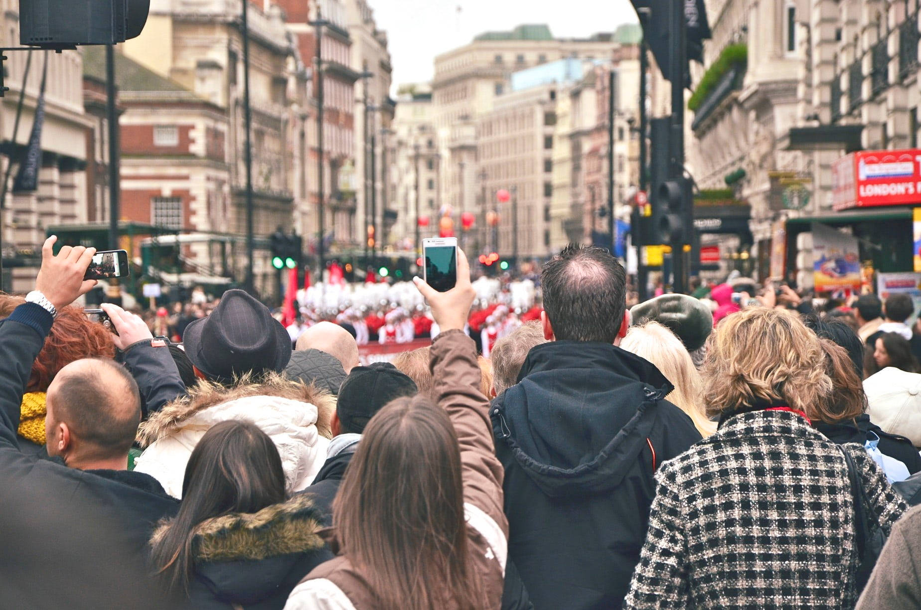 Group Of People Watching A Parade Wallpaper