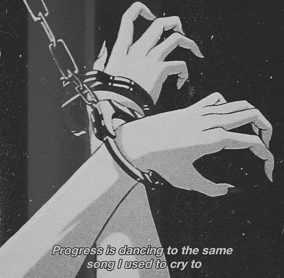 Grunge Aesthetic Handcuffs Progress Quote Wallpaper