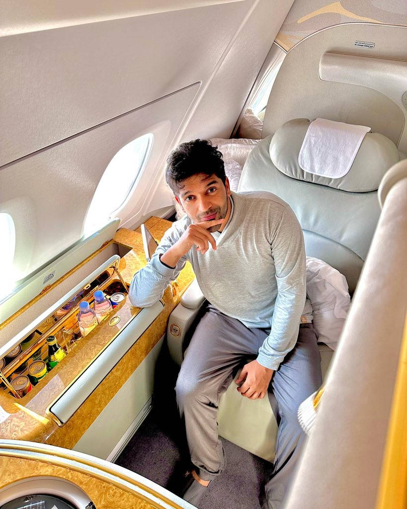 Guru Randhawa Relaxing In His Plane Seat Wallpaper